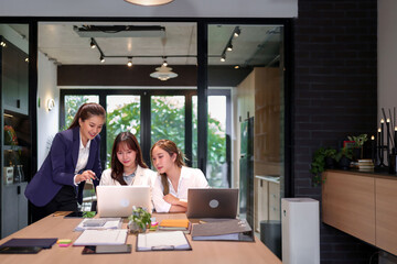 Asian Women Teamwork Collaboration in Modern Office Analyzing Data on Laptop Business Meeting Team Discussing Project Strategy Corporate Group Working Together