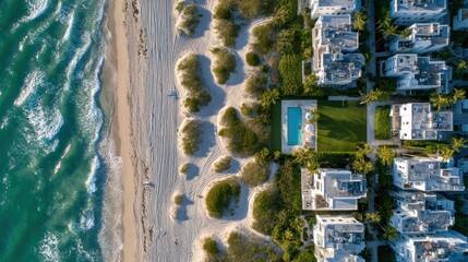 Aerial panorama showcasing coastal real estate with beachside views and turquoise waters