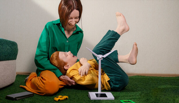 Mother and son playing with a wind turbine model at home