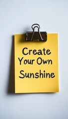 Create Your Own Sunshine. Motivational Quote On A Yellow Sticky Note, Isolated On White Background.
