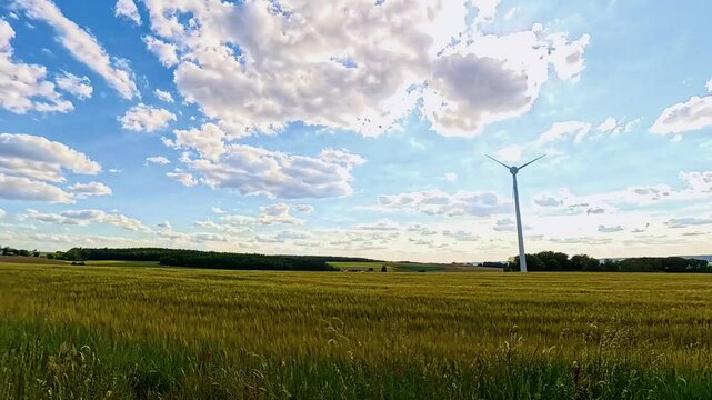 4K Timelapse video with moving clouds and wind power plants near Kugl, Simbach bei Landau, Dingolfing-Landau, Bavaria, Germany