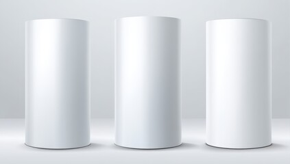 Three blank cylindrical displays on a light gray background