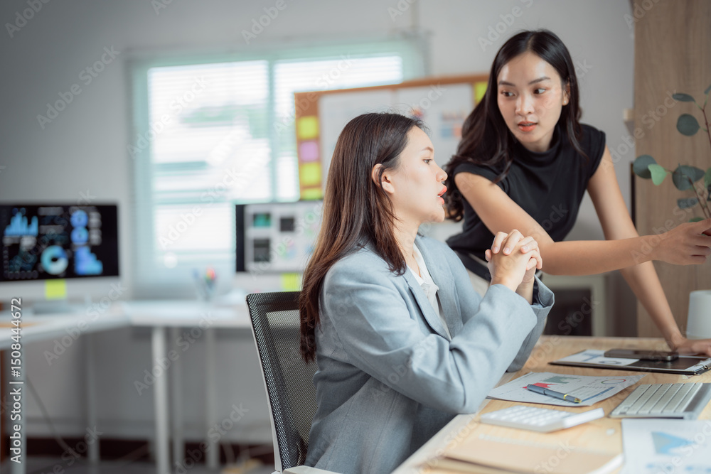 Poster two asian businesswomen engaging in a discussion about marketing strategy while analyzing financial 