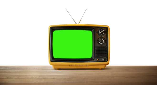 Old yellow television set with green screen showing on wooden table with transparent background