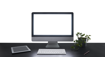 Modern workspace featuring glowing computer screen, keyboard, and tablet on desk with transparent background
