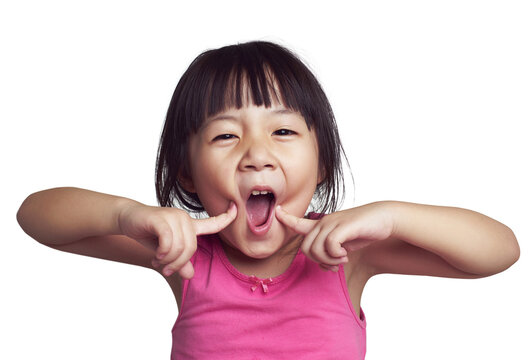 Naklejki Young girl making funny face with fingers on cheeks, transparent background