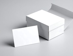 White box and blank card on grey background