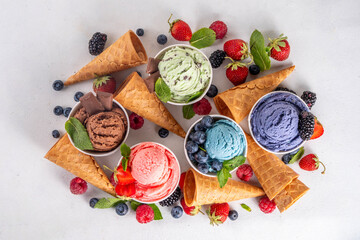 Fototapeta na wymiar Colorful bright ice cream on bowls, with waffle cones