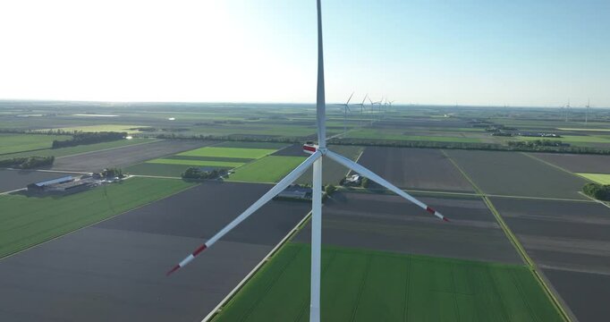 wind turbines in the Flevopolder, symmetrical agricultural fields, power from the wind, wind farms, electricity for households, wind energy, renewable electricity, sustainable energy. Aerial view.