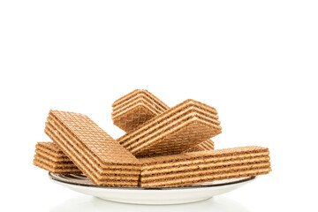 Sweet waffles on a ceramic saucer, close-up, isolated on a white background.