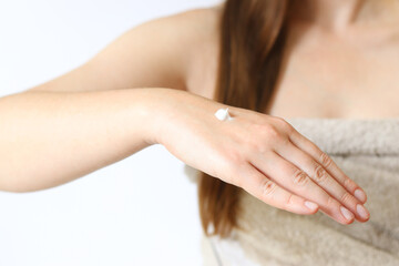 Hand cream. Close-up of young woman's hand with moisturizing cream. Skin care. Close-up of female hands applying cream to skin. Healthy skin, skin care concept. Cosmetology. Daily routine