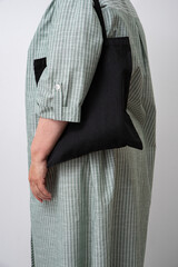 woman holding black reusable Shopper. Eco-friendliness in everyday life