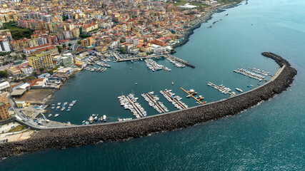 Aerial view of the port of the city of Torre del Greco in the province of Naples, Campania, Italy. There are many boats anchored in the marina. © Stefano Tammaro