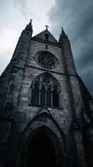 Tall Gothic Stone Church Tower Under a Stormy Sky