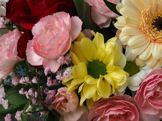 colorful different types of flowers in a bouquet, daisy, carnation, dahlia, rose, gypsophila,...