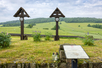 World War I Cemetery Number 123 in Luzna Pustki, Poland, featuring wooden crosses marking graves...