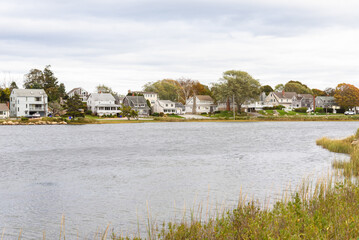 Residential district along a lagoon in Connecticut on a cloudy autumn day