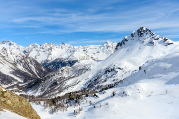 Majestic snowy mountain range in the Swiss Alps on a sunny early spring day