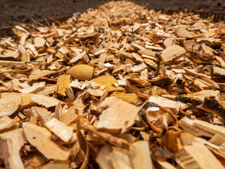 Golden Wood Chips Spread on Dark Earth