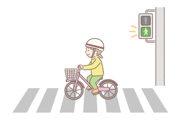 横断歩道を自転車で渡る女の子