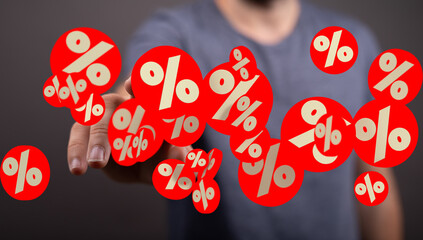 Image of a person interacting with digital percentage symbols, ideal for sale, discount, or finance...