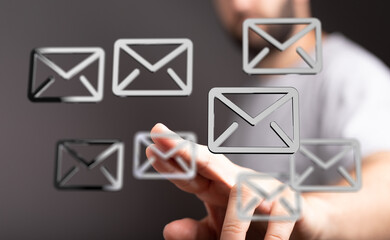 Person interacting with digital email icons. Concept for email management, inbox organization, and...