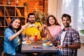 Indian youth bonding over tea, conversation in a relaxed cafe setting during a break from college