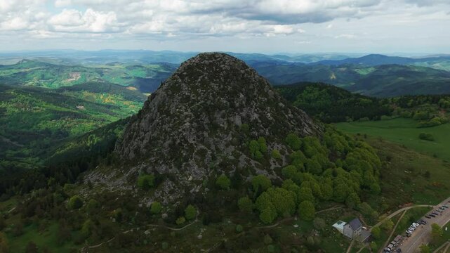aerial shot above the Mont Gerbier de Jonc, source of the Loire River in Ardeche on a cloudy day, Auvergne Rhone Alpes region, France