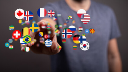 Person touching digital flags, representing international communication and global connections.