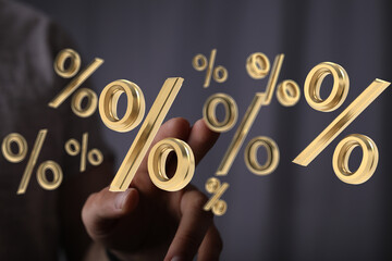 3D rendered gold percentage symbols float above a hand, ideal for finance, discount, and sale...