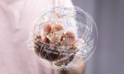 Hand holding a digital globe showing data connections and internet information. Futuristic...