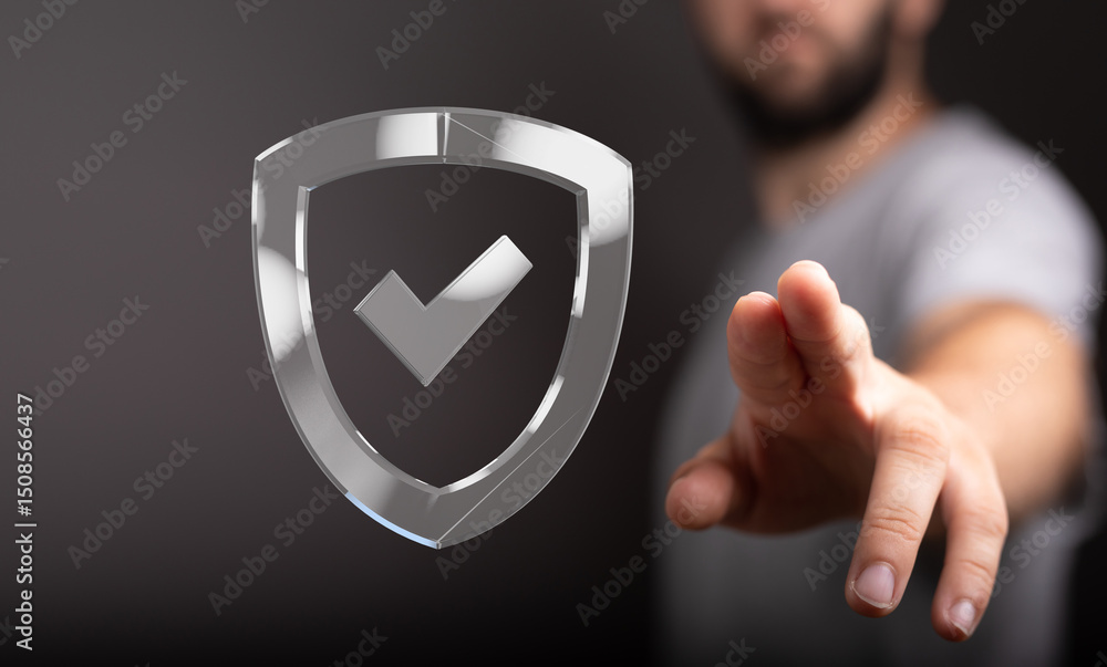 Poster Cybersecurity concept.  Man interacts with a digital shield, representing data protection and online safety.
