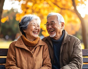 Elderly couple laughing outdoors
