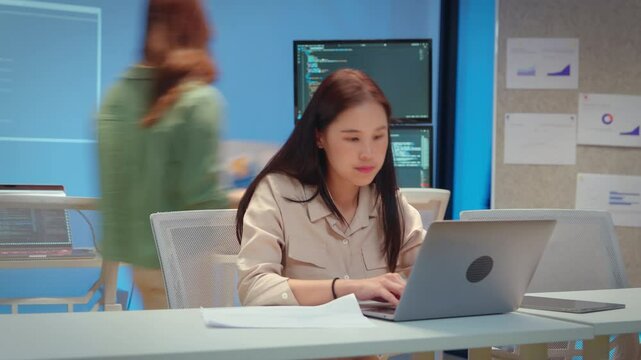 Professional computer engineer working on a new software technology design in the office Night, focus or programmer review search engine process, software or IT database development