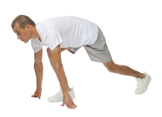 Runner in starting position on white background