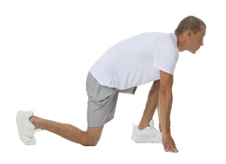 Runner in starting position on white background