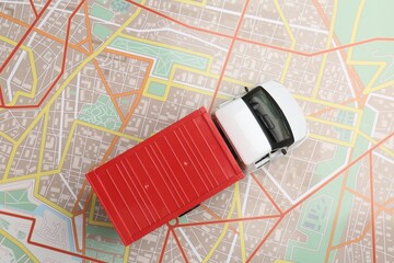 Road trip concept. Truck model on city map, top view