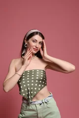 Gordijnen Fashionable portrait of beautiful woman in stylish outfit on pink background © New Africa