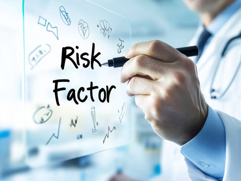 Doctor writing about risk factor on transparent board in modern clinic