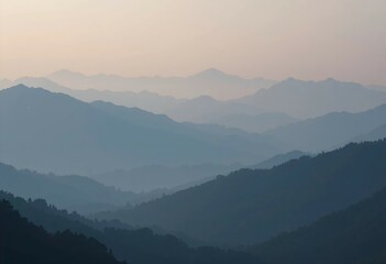 Fototapeta premium Layered Mountain Range Silhouette at Sunset - Misty Blue Peaks Landscape