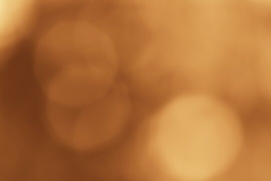 Abstract Brown Bokeh Background with Soft Circular Highlights