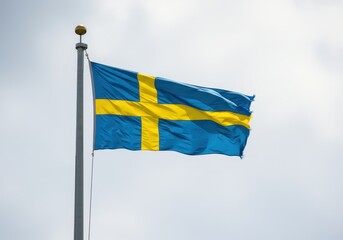 Sweden flag waving against a bright sky, symbol of swedish identity and national pride
