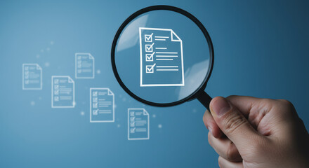 Audit Checklist Review: A Hand with Magnifying Glass Examines Approved Compliance Documents
