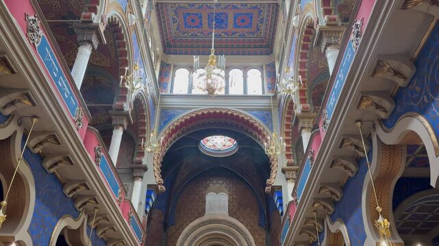 Vibrant interior of a Jewish synagogue with stained glass