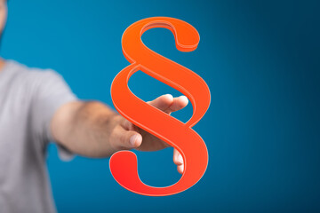 Abstract image of a hand interacting with a paragraph symbol, ideal for legal or writing concepts.