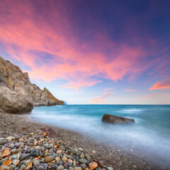 Amazing view of the beach and rocks shot with a long exposure.