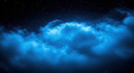 Obraz premium A celestial spectacle unfolds with a vibrant blue nebula amidst a star-studded night sky, evoking a sense of cosmic wonder and ethereal beauty in the vast expanse of space