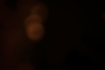 Amber lights dancing softly through the night's blurry canvas of obscurity