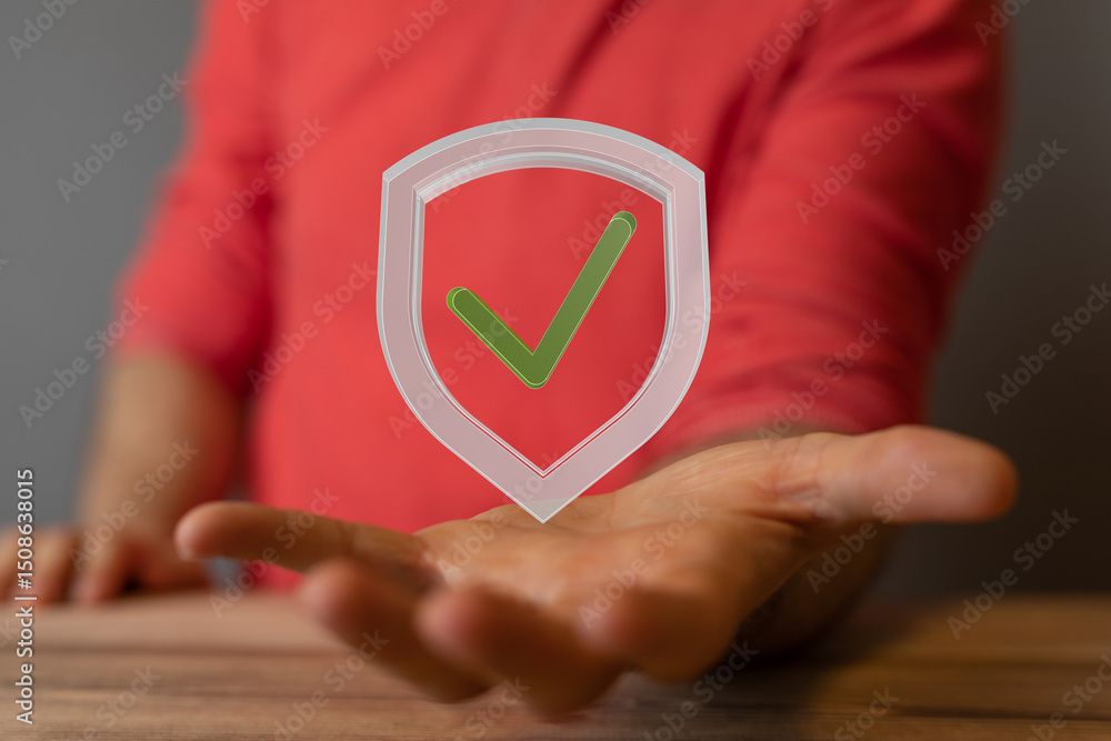Poster High-quality image of a hand holding a digital shield with a check mark, symbolizing data security and safety.