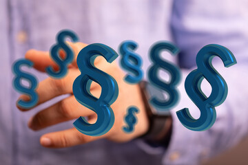 3D rendering of blue paragraph symbols hovering near a person's hand, representing legal concepts.